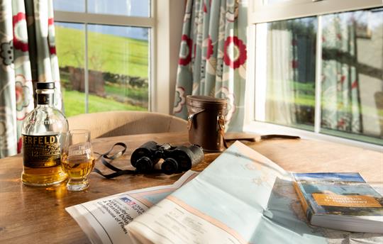 Bay window with abundant wildlife and flower beds