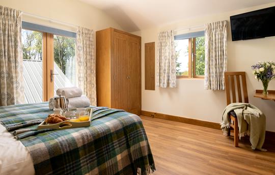 Bedroom 4 with patio doors to shared balcony