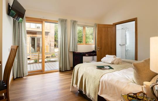 Bedroom 1 with ensuite shower room and patio doors