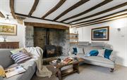 Cosy sitting-room with woodburner & exposed beams