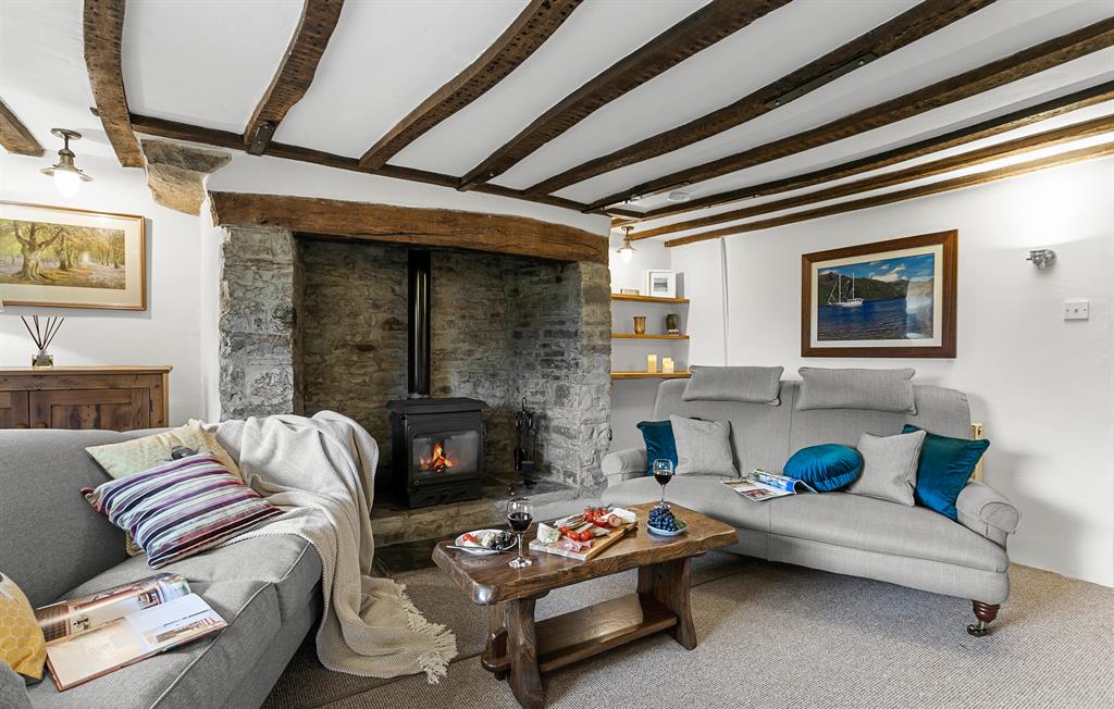 Cosy sitting-room with woodburner & exposed beams