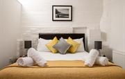 Luxurious king sized bed with hotel quality linen