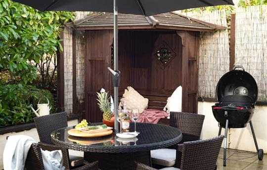 Gazebo, BBQ and dining table on the patio