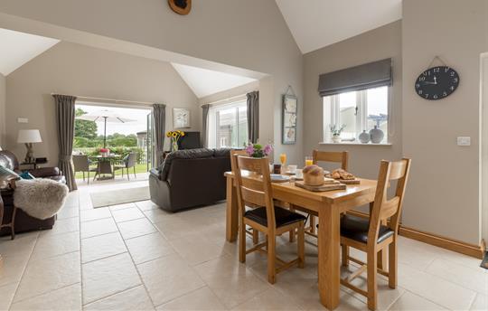 Open plan dining, lounge and kitchen