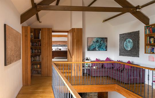 Landing with sofa and books