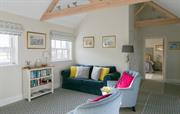 Full height ceilings with exposed beams throughout