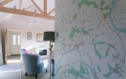 Bright and airy sitting room with OS map on wall