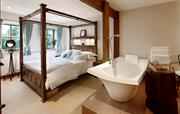  King-size, en suite bedroom with a large bath