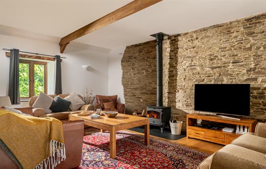 Corn Barn lounge with wood burning stove.