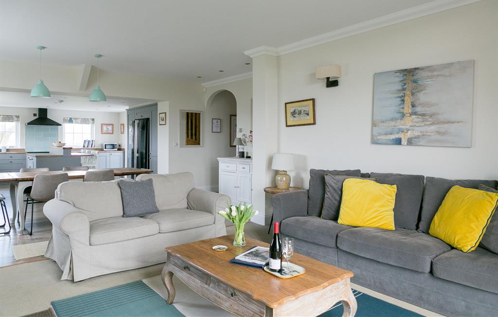 Open plan lounge with doors onto private patio