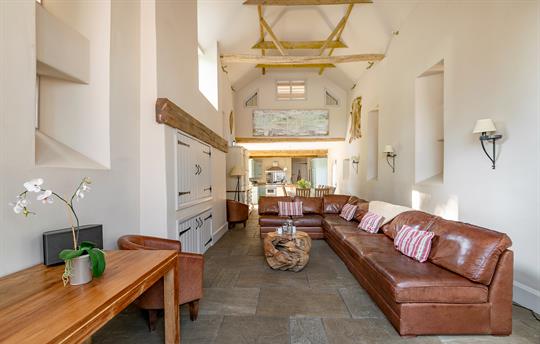 Open plan seating area with hidden smart tv