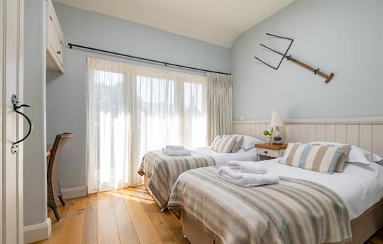 Cartshed bedroom made up as a twin room