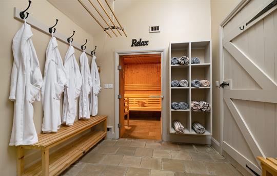 Sauna with pool robes and towels