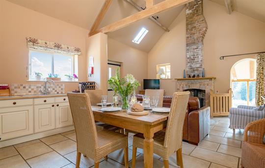 Dining area with table which seats four