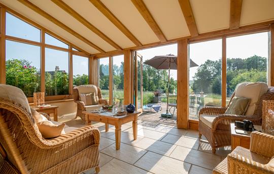 Garden room with french doors leading onto terrace