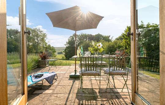 View from the garden room with outdoor furniture