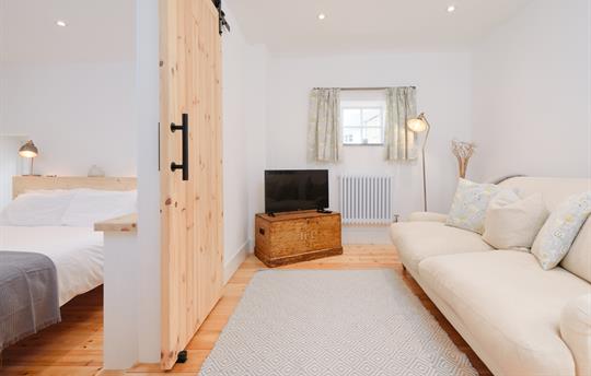 lounge and steps down to the en-suite bedroom