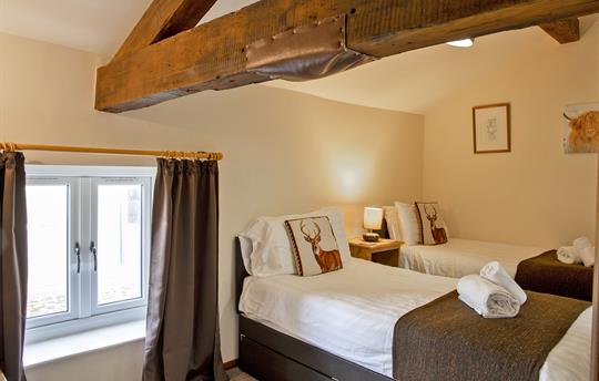 Twin bedroom with wonderful beams
