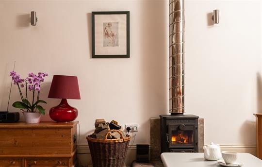 Old Dairy log burner in living room