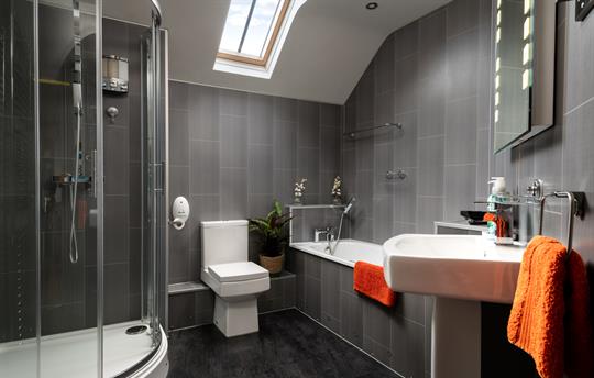 Bathroom with bath and separate shower