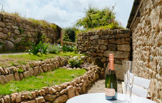 Secluded, terraced garden and main gate.
