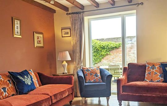 Barn living looking onto courtyard garden