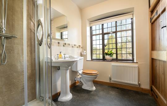Large ensuite shower room with garden views