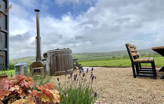 Optional wood-fired hot tub experience available.