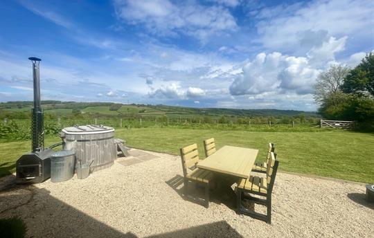 Wood fired hot tub (extra) and external seating.