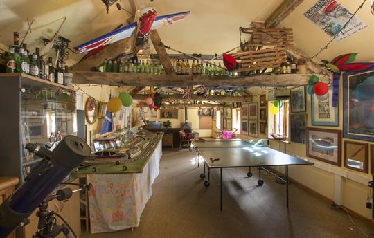 Characterful Games room with huge log burner