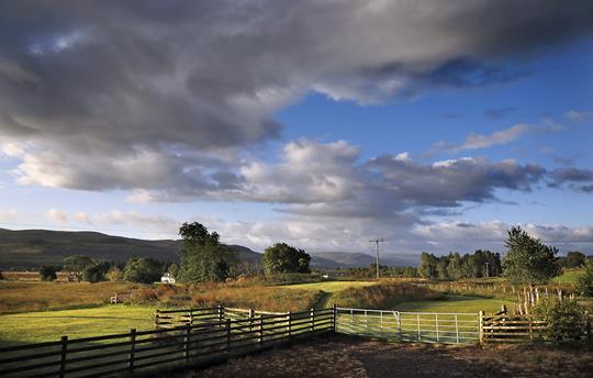 Gask House - view across gardens and farm 