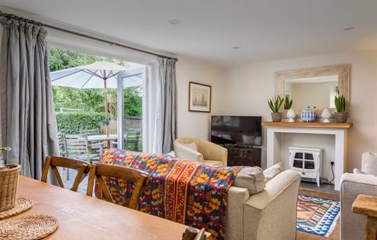 Sitting room at Garden Cottage with dining table 