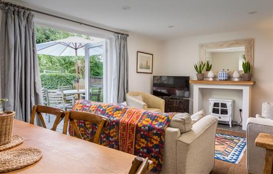 Sitting room at Garden Cottage with dining table 
