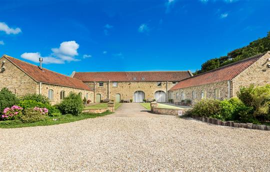 High Barn cottages and courtyard. Spinney on left
