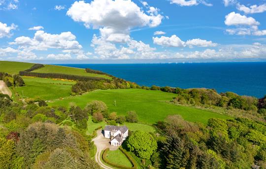 Sea views, extensive garden and mixed woodland