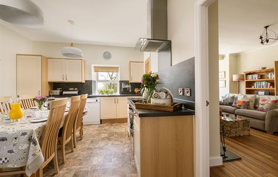 Kitchen leads through to the spacious sitting room