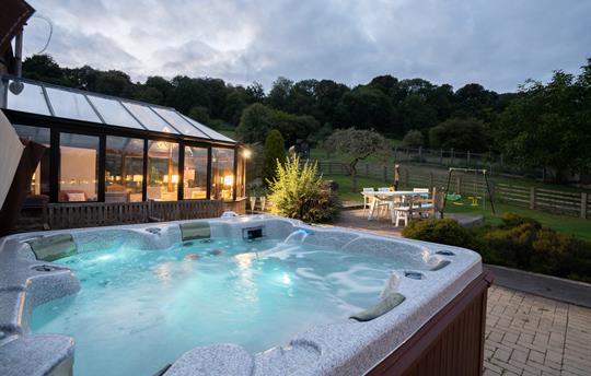 Manor Hot Tub at Dusk – Relax with Stunning Views