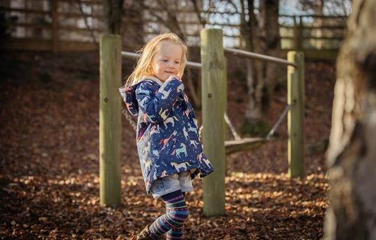 Girl Playing in Trees