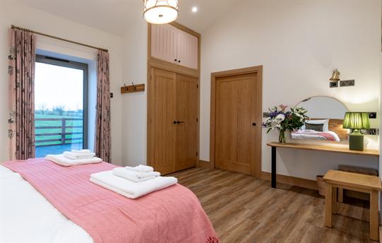 Bedroom with generous built in wardrobe