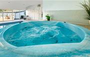 Wonderful hot tub next to the swimming pool