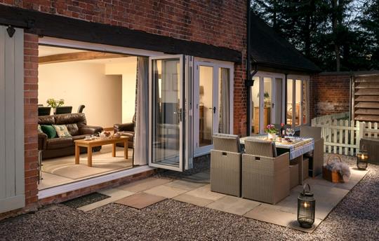 Outside patio area with dining table and chairs