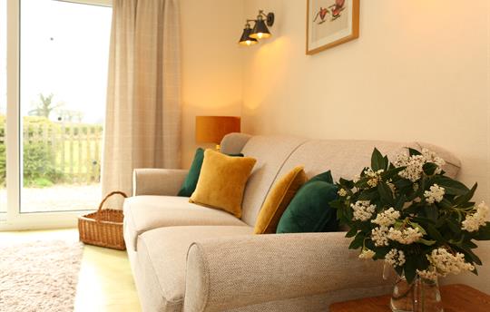 Unwind on a comfy sofa with a view to end the day