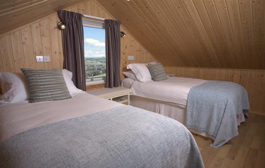 Upstairs bedroom combed ceiling - twin/double