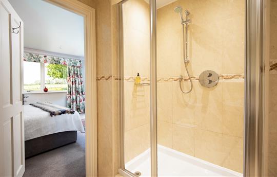 Super king size bed with ensuite step in shower.