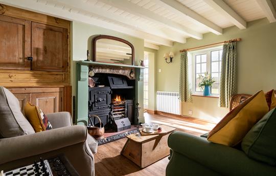 Lounge with cosy woodburner