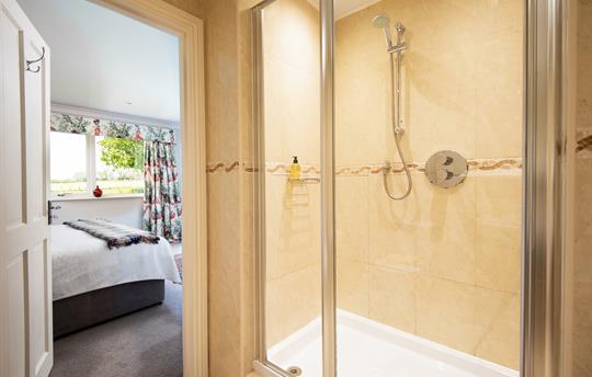 Super king size bed with ensuite step in shower.