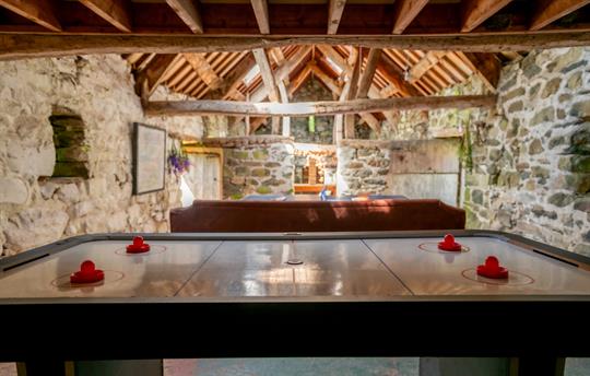 Air hockey in the Gwanas Fawr games barn
