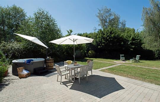 Large enclosed private garden with patio area