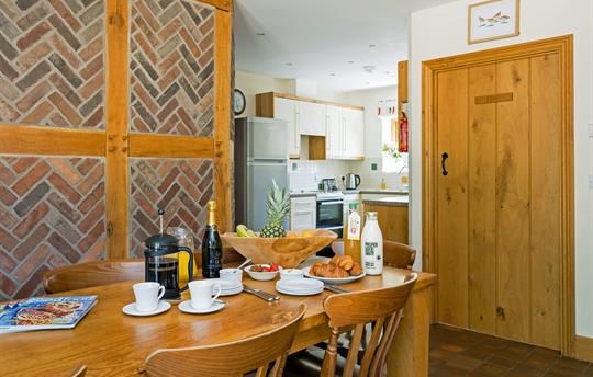 Dining room with kitchen beyond