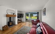 Lounge with bi-fold doors opening to patio